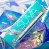 suva beauty's tiny treasures rhinestones packaging on a holographic background