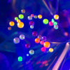 Close-up image of the UV neon round flat back crystal rhinestones in the tiny treasures kit