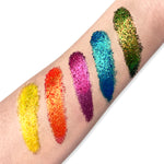magic and ecstasy glitter swatches on arm